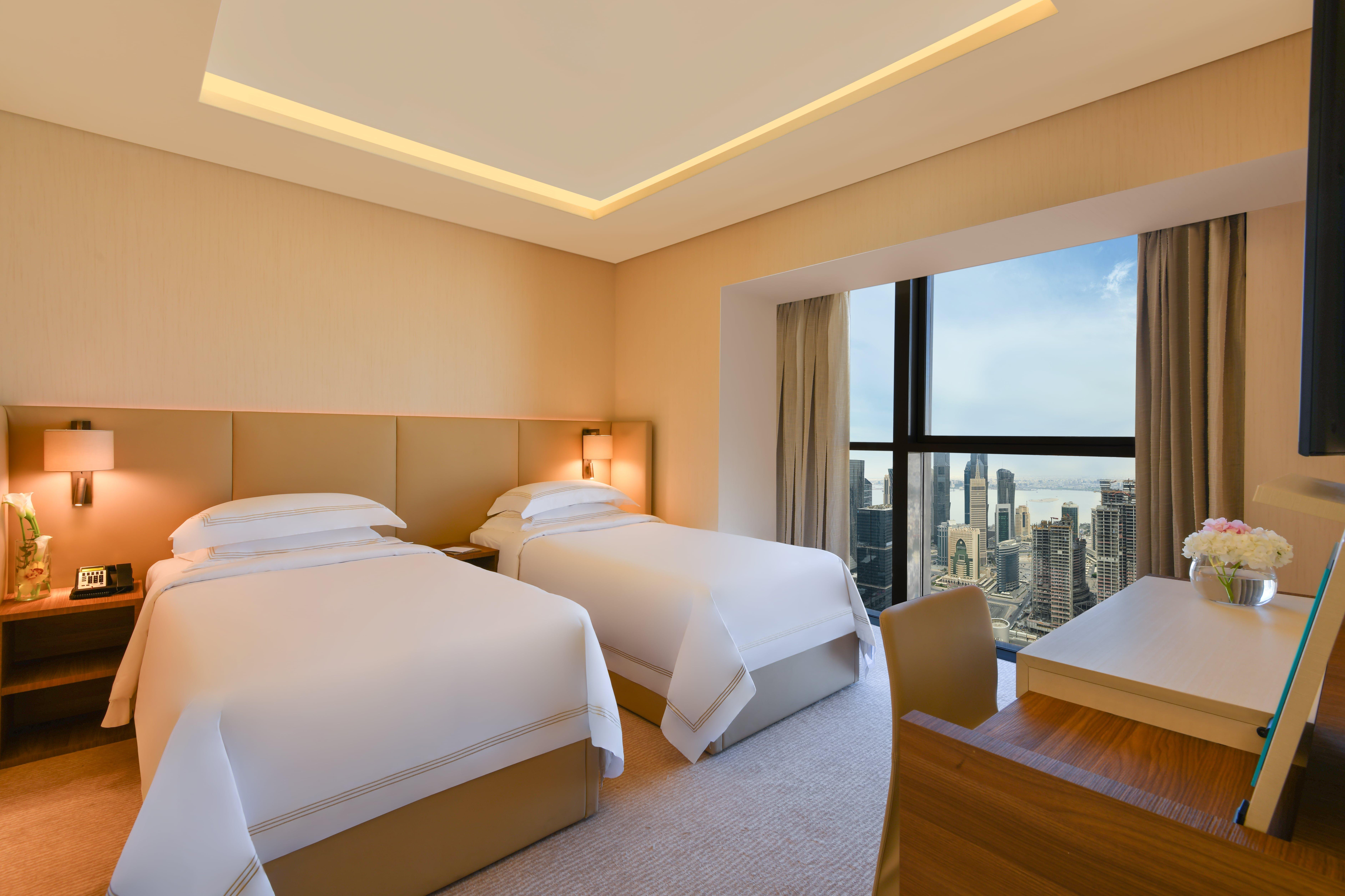 Voco Doha West Bay Suites By Ihg Exterior foto Deluxe Room