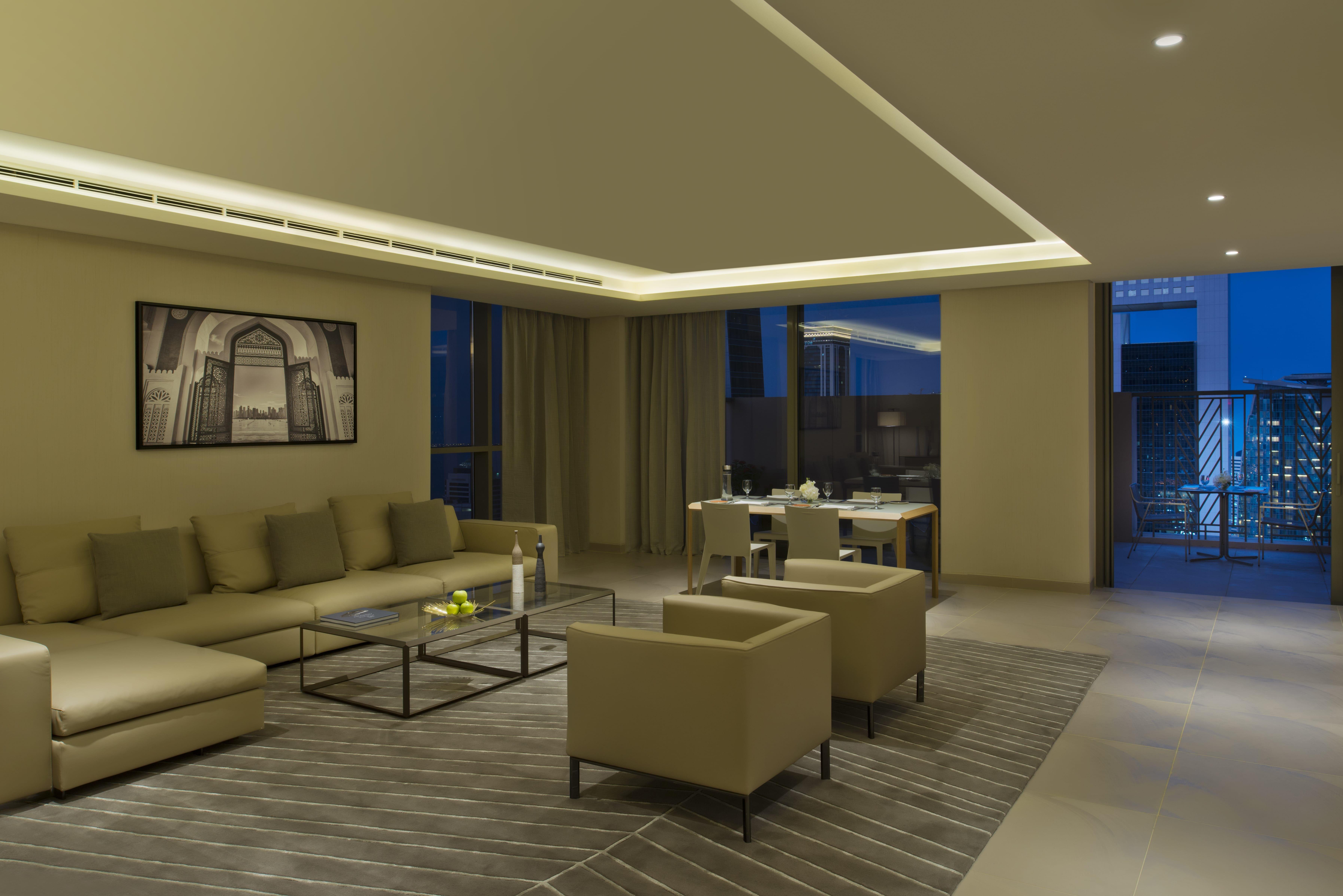 Voco Doha West Bay Suites By Ihg Exterior foto A living room in a typical apartment